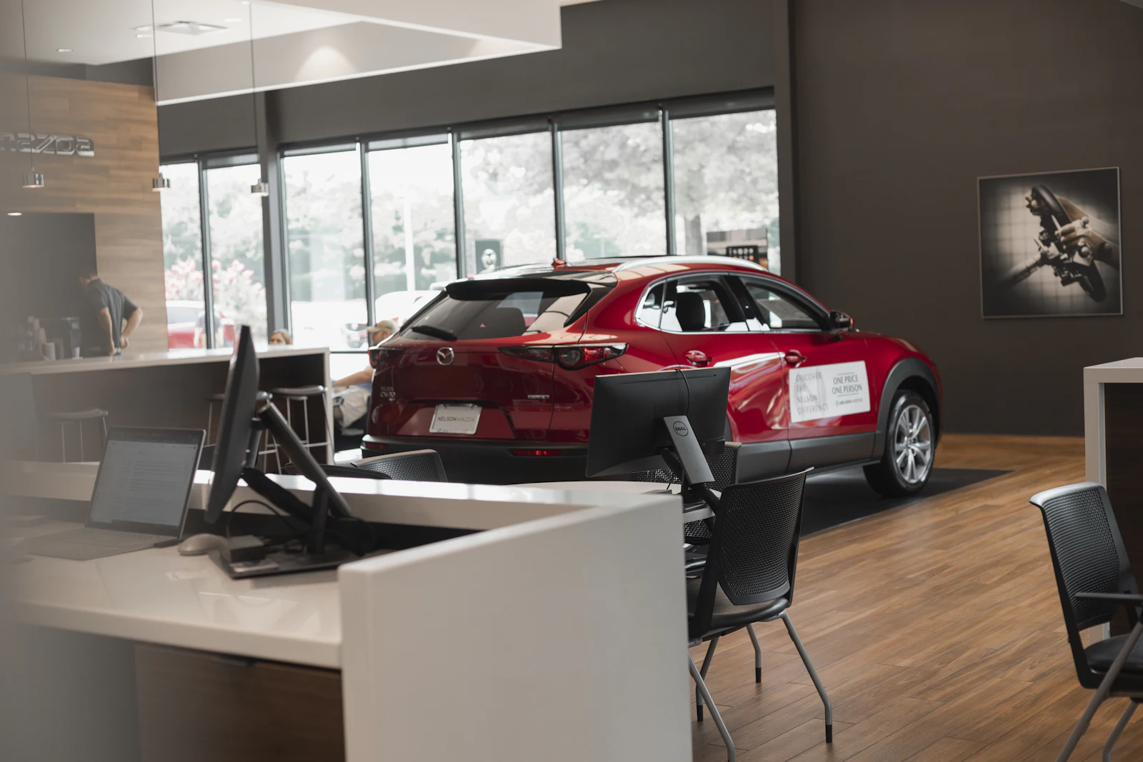 A car on display in a dealership showroom.